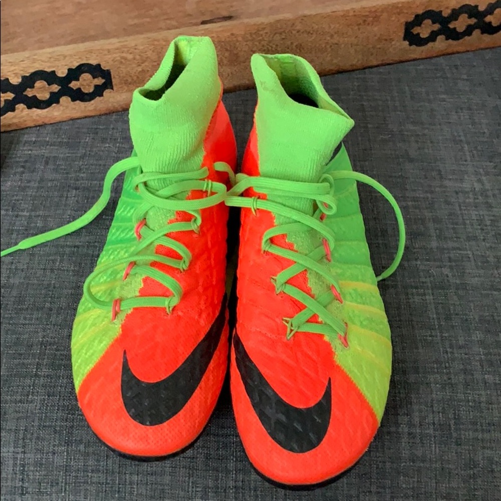 Orange and green soccer cleats